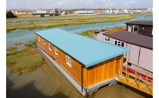 Building a retirement houseboat in Shoreham from scratch. Tata roofing system went up in just one day